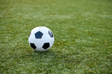 close-up photo of ball on grass in stadium, sport and football, soccer concept