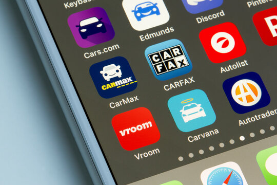 Portland, OR, USA - Jun 22, 2020: Assorted car dealer mobile apps are seen on a smartphone, including Vroom, Carvana, Autotrader, CarMax, CARFAX, Autolist, Cars.com and Edmunds.