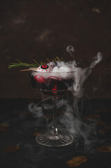 Halloween cocktail with eye and fog