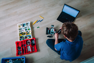 boy building robot at home, STEM for kids