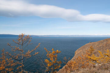 Baikal lake fresh water
flora shore reserve Russia Irkutsk park island Sky clouds clear Olkhon rocks trees embankments sand bay lagoon stones mountains hills horizon line panorama autumn water waves 