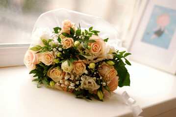 Beautiful wedding bouquet on a white windowsill