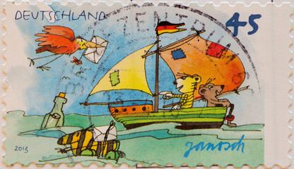 GERMANY - CIRCA 2013 : a postage stamp from Germany, showing a postage stamp for the children a sailing boat from Janosch