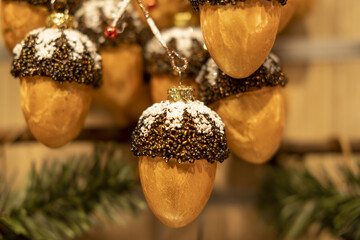 Christmas tree branch with acorn, close-up. New Year vintage ornament for festive