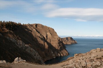 Baikal lake fresh water
flora shore reserve Russia Irkutsk park island Sky clouds clear Olkhon rocks trees embankments sand bay lagoon stones mountains hills horizon line panorama autumn water waves 