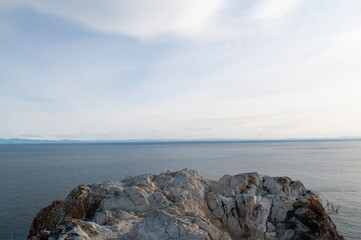 Baikal lake fresh water
flora shore reserve Russia Irkutsk park island Sky clouds clear Olkhon rocks trees embankments sand bay lagoon stones mountains hills horizon line panorama autumn water waves 