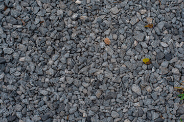White crushed stones texture background. Gray rubble construction rock pebble pattern. 