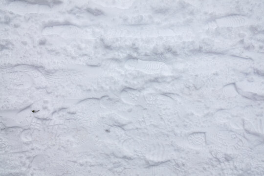 Snow texture background of  a white winter season Christmas snowfall in December, stock photo image