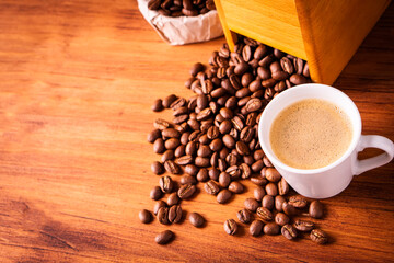 Fresh cafe for morning breakfast refresh caffeine white cup roasted organic coffee bean farm in vintage wood grinder classic metal coffee pot for black espresso and cream milk cappuccino latte