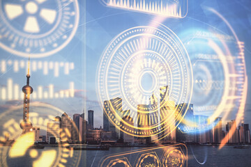 Double exposure of technology theme hologram and cityscape background. Concept of Hightech.