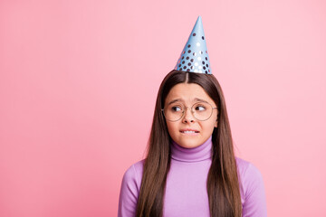 Photo of frightened small kid girl look copyspace wear violet jumper isolated over pastel color...