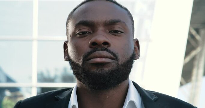 Serious Confident African-American Businessman is looking direcktly to the Camera. Concept of Protest, Black Lives Matter. African American Portrait. People. Human. Black Businessman.