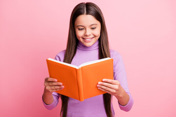 Portrait of her she nice attractive pretty lovely educated cheerful cheery focused long-haired girl reading dictionary paper book isolated over pink pastel color background