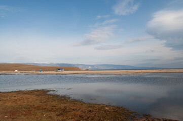 Baikal lake fresh water
flora shore reserve Russia Irkutsk park island Sky clouds clear Olkhon rocks trees embankments sand bay lagoon stones mountains hills horizon line panorama autumn water waves 