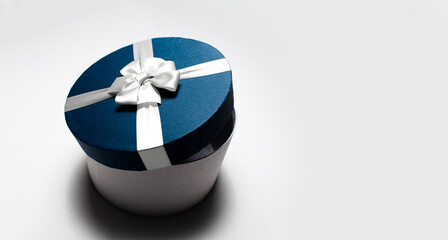 Top view of round half opened gift box isolated on white background with copy space.