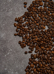 roasted coffee beans and a cup of coffee