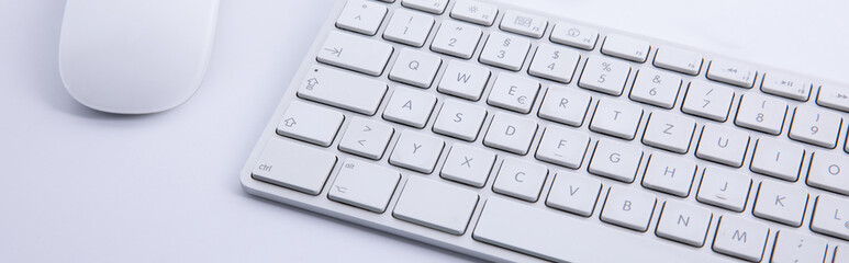 new modern keyboard witnew modern keyboard with computer mouse and smartphone with earphones isolated on white background, close view h computer mouse and smartphone with earphones isolated on white