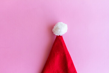 Christmas santa hat, isolated on pink