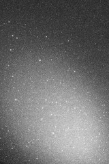 Gray background with sparkles and spot of light