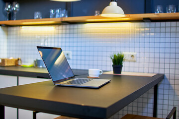 Comfortable workspace for remote online work in a modern loft interior
