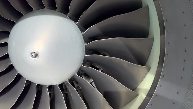 Close Up Spinning Fan in Jet Engine Air Intake.