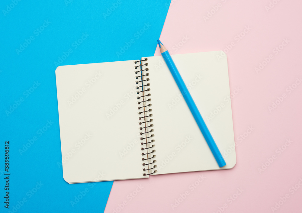 Poster open notepad with empty white sheets on a blue background