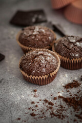 
Chocolate muffins with powdered sugar