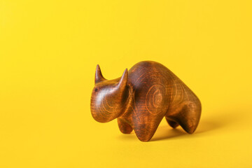 Figurine of bull as symbol of year 2021 on color background