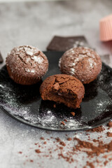 
Chocolate muffins with powdered sugar