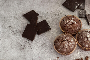 
Chocolate muffins with powdered sugar