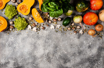 Border from pumpkin and fresh vegetables and herbs. Top view with copy space.