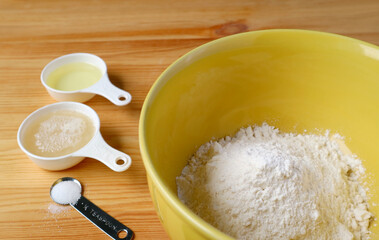 Baking ingredients on the wooden table for the concept of HOME COOKING