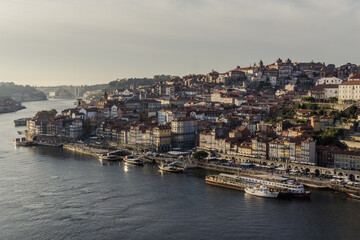 Fototapeta na wymiar Panoramic view of Porto old Town, the Ribeira and the Douro River, during the sunset.