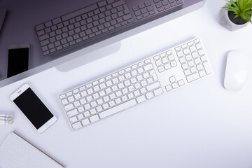 new modern keyboard with empty screen and computer mouse with smartphone isolated on white background, close view . High quality photo