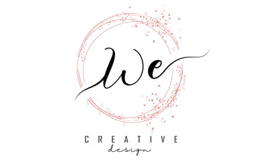 Handwritten WE W E letter logo with sparkling circles with pink glitter.