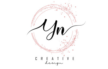 Fototapeta Handwritten YN Y N letter logo with sparkling circles with pink glitter. obraz