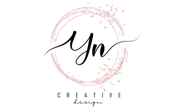 Handwritten YN Y N letter logo with sparkling circles with pink glitter.