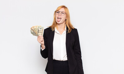 pretty woman  with cheerful, carefree, rebellious attitude, joking and sticking tongue out, having...