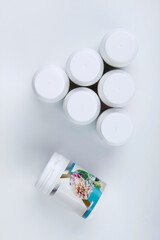 Plant fertilizer bottles on white background