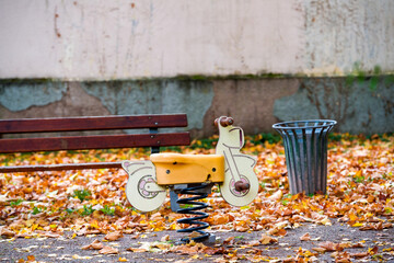 Empty child bike in the park near waste bin