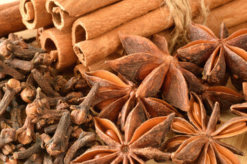 cinnamon sticks, anise stars, cloves close up food background