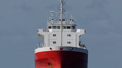 MERCHANT VESSEL - Red ship on a cruise at sea
