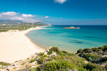 Fototapeta na wymiar cristal clear water and white sand in Su Giudeu beach, Chia, Sardinia