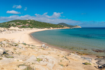 Fototapeta na wymiar Rocks and emerald water in Campana Beach, Chia, Sardinia