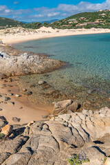 Fototapeta na wymiar Rocks and emerald water in Campana Beach, Chia, Sardinia