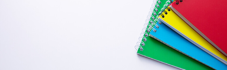 collection of colorful notebooks isolated on white background, close view. High quality photo