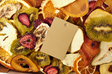 Close-up dried fruits with craft paper card