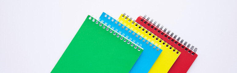 collection of colorful notebooks isolated on white background, close view. High quality photo