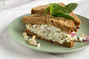 sandwich with egg salad on wholegrain bread.