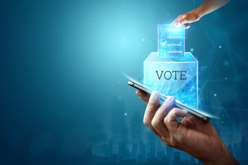 Online voting, Hand with a hologram ballot and a box for Internet voting in a mobile phone on a...